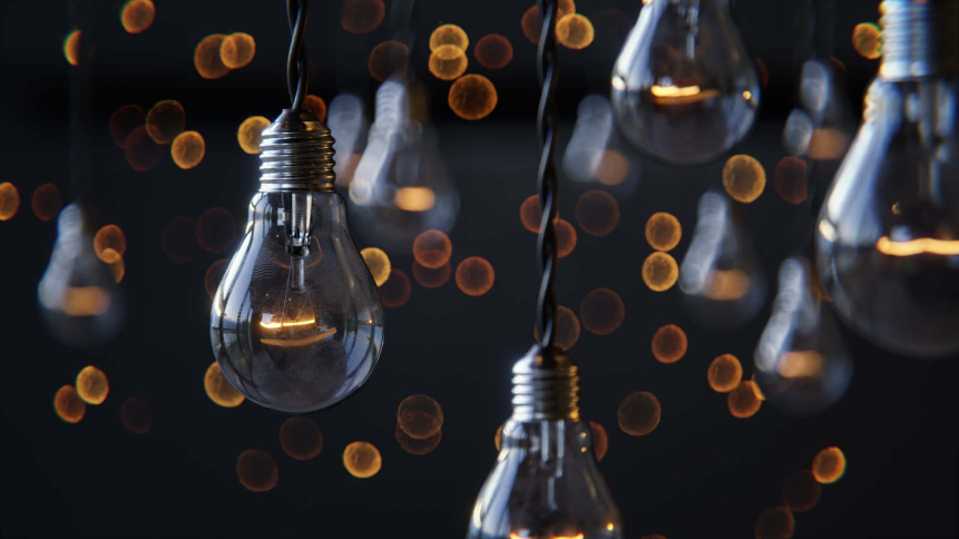 Light bulbs handing by their wires from the ceiling